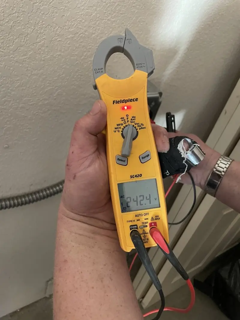 Voltage testing with clamp meter during Generator Installation in Northbrook